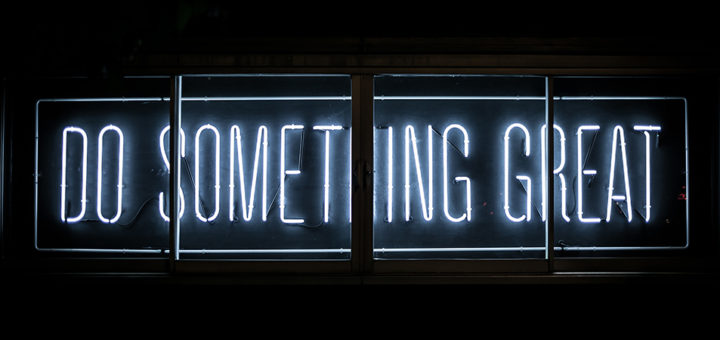 Neon sign that says, "Do Something Great"