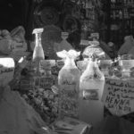 Black and white image of glass bottles in different sizes and shapes