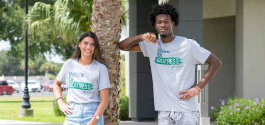 Students posing for photo wearing shirts that say Chosen for greatness