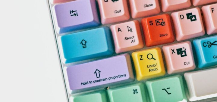 A colorful keyboard with text on the key displaying computing shortcuts.